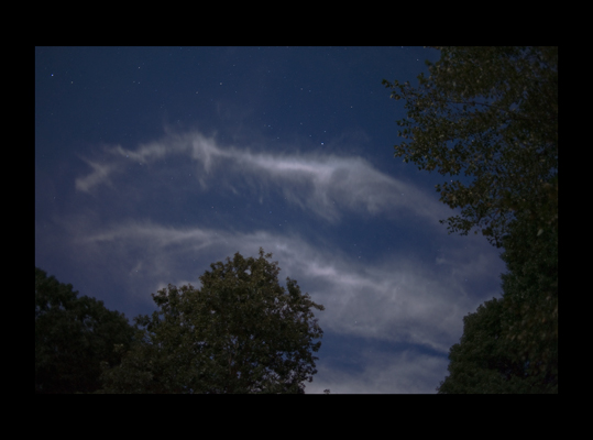silvery clouds in moonlit starry sky